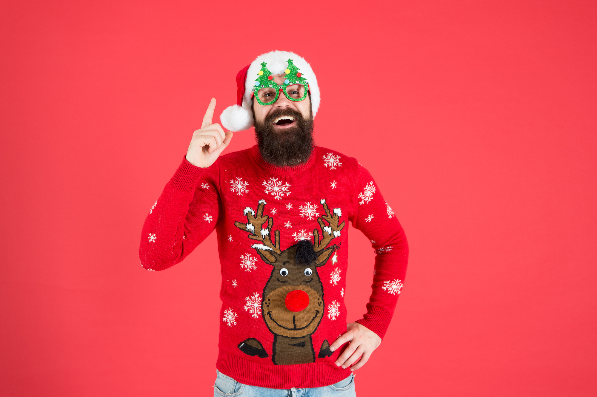 An OFFICIAL bearded man participating in a BAR CRAWL wearing an UGLY SWEATER.