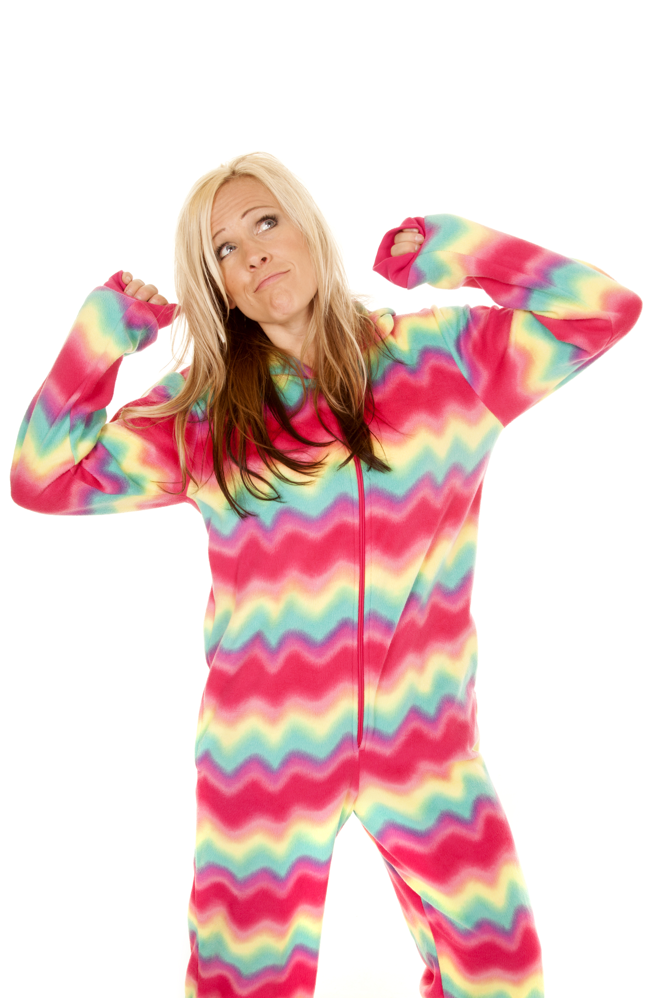 A woman in a colorful onesie participating in the Pajama Crawl event, while striking a pose for the camera.