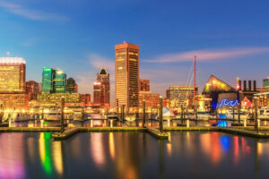 Baltimore city skyline at dusk during a holiday evening.