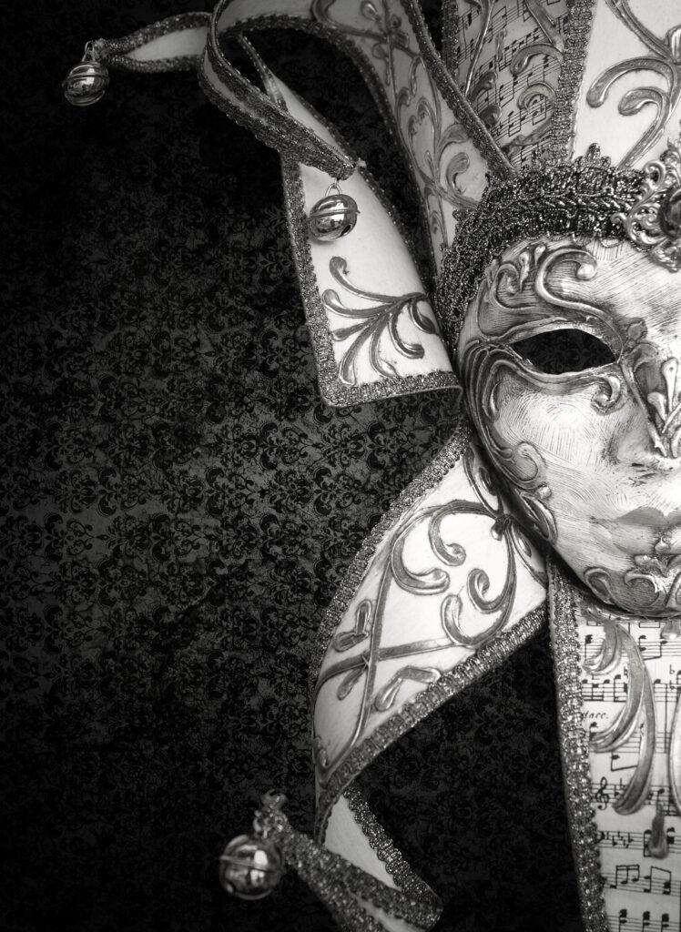 A black and white photo of a venetian mask, perfect for Mardi Gras.