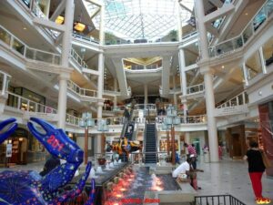 A bustling shopping mall brimming with people enjoying their holiday excursions in Baltimore's Inner Harbor.