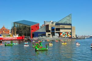 A group of people on boats enjoying a holiday voyage in Baltimore's Inner Harbor.