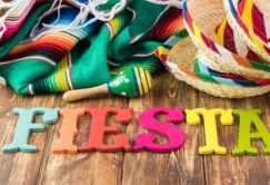 Mexican fiesta table decoration with colorful fiesta maracas, so