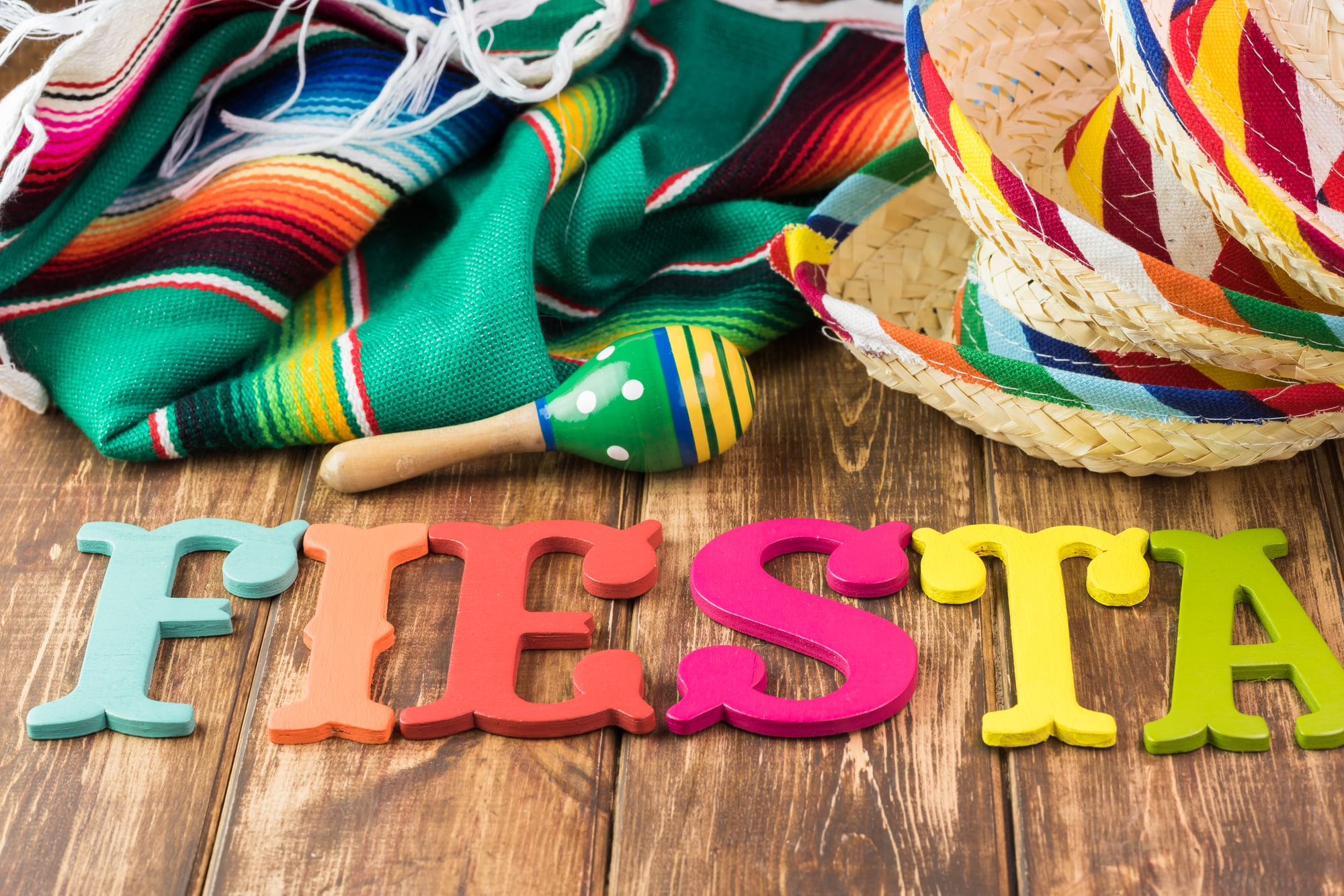 Mexican fiesta table decoration with colorful fiesta maracas, so