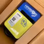 Harbor Park charger in a box, labeled with a QR code and 