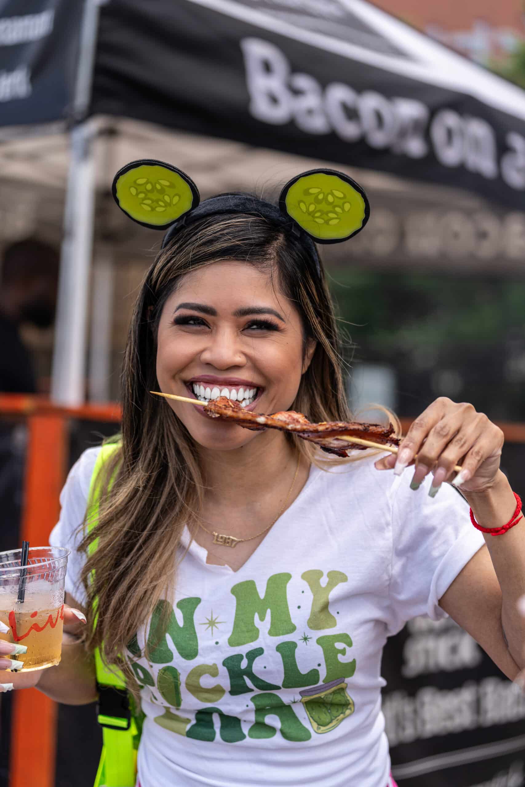 A woman wearing pickle-shaped headbands and a 